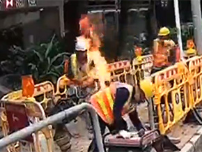 Man on fire put out by bucket of fuel