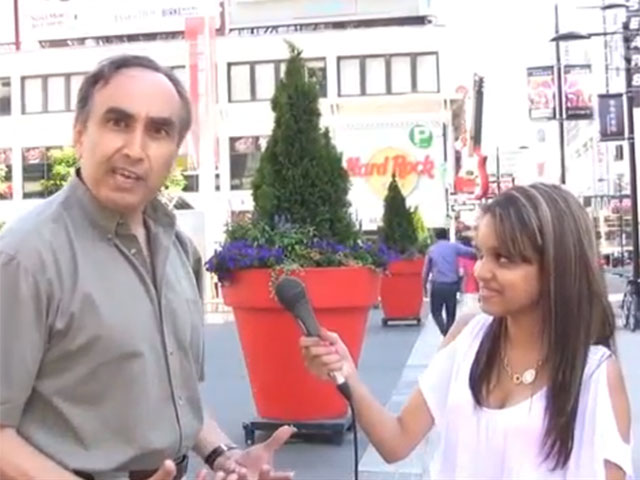 Man goes crazy rips off shirt during street interview